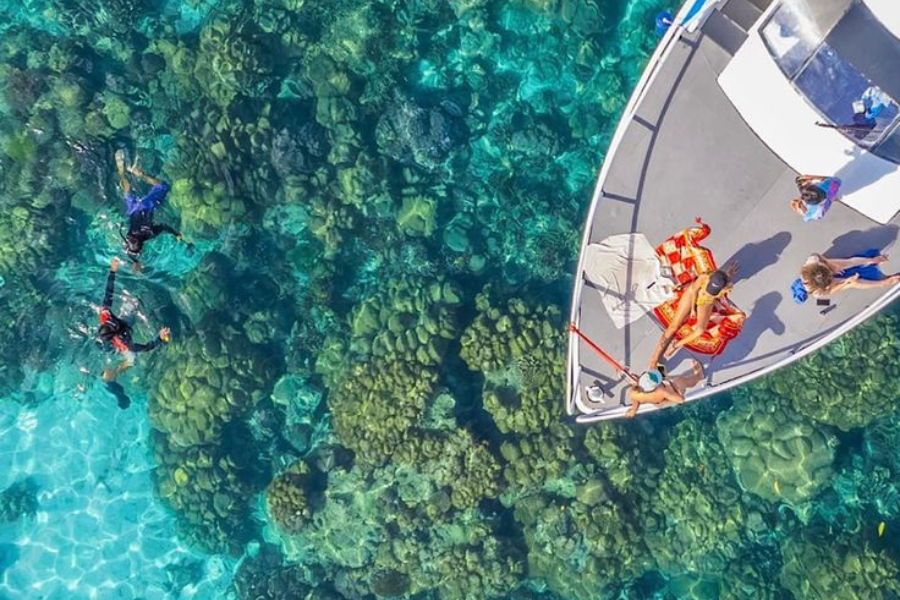 Tourists snorkeling from a boat in the Red Sea near Hurghada, Egypt.