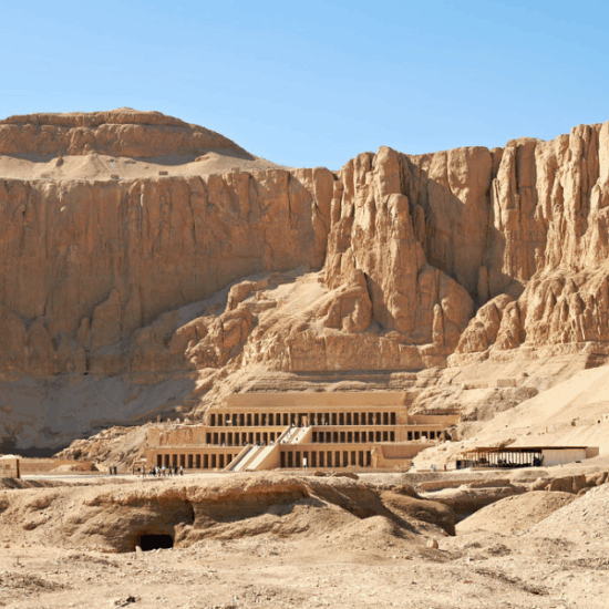 Couple standing in front of Hatshepsut Temple during a private Egypt tour.