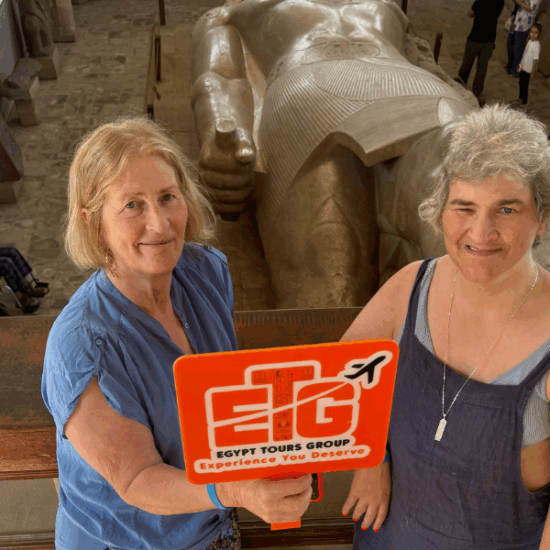 Two senior female travelers visiting the Grand Egyptian Museum in Giza with Egypt Tours Group.