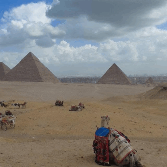 The Giza Pyramids standing under the clear desert sky in Egypt.