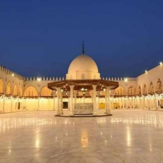 An elderly man standing inside Amr Ibn Al-As Mosque, Cairo