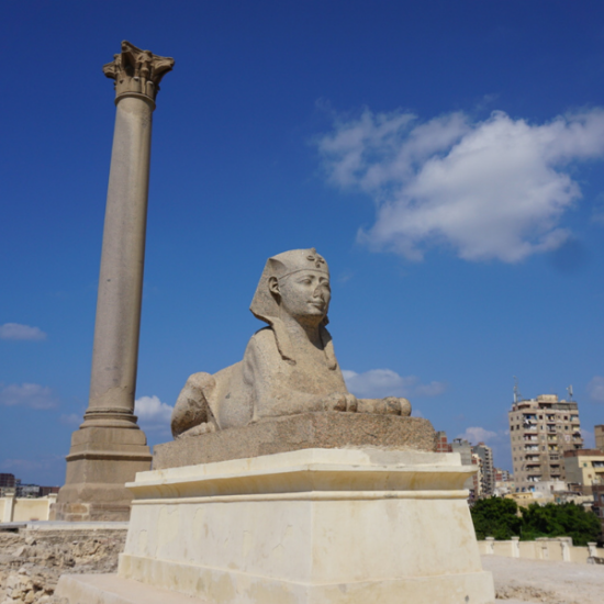 Tour group visiting Pompey’s Pillar in Alexandria, Egypt