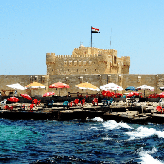 People visiting Qaitbay Citadel on the sea in Alexandria, Egypt