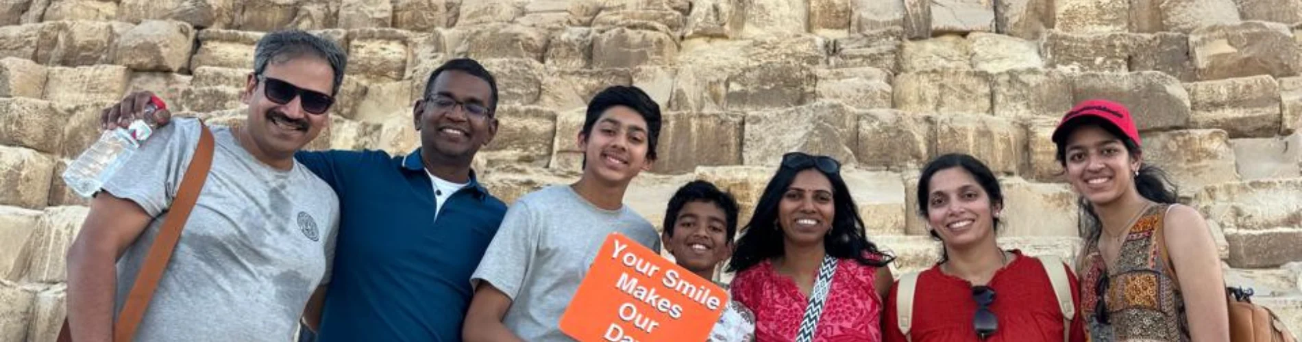 A family standing in front of the Pyramids of Giza in Egypt - 4 Days Cairo & Alexandria Family Holiday