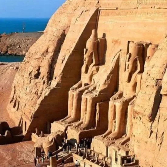 Abu Simbel Temples by day with visitor, a part of our 13 Days Cairo, Alexandria, Luxor & Aswan Family Tour