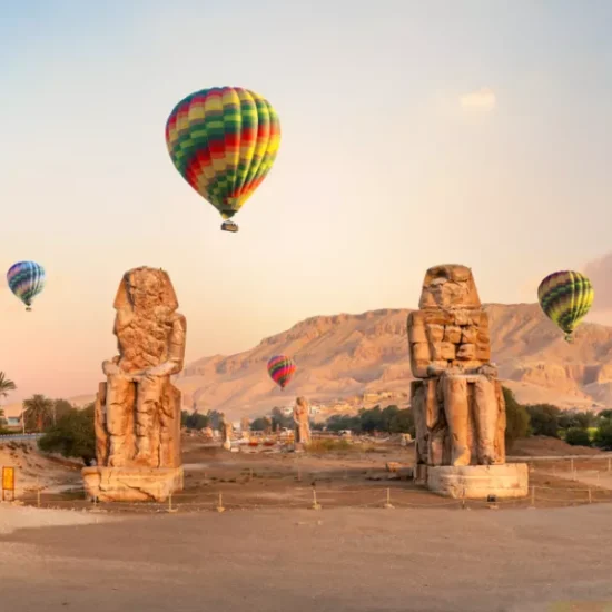 Colossi of Memnon with hot air balloons, a part of our 12 Days Cairo, Nile Cruise & Sharm El Sheikh Family Tour