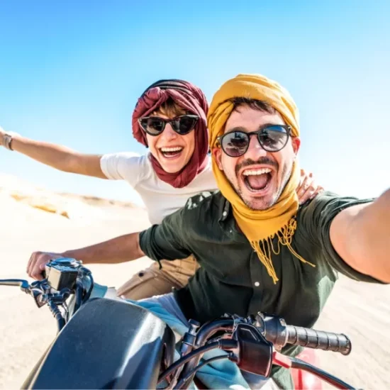 Couple riding beach buggy Sharm desert, a part of our 12 Days Cairo, Nile Cruise & Sharm El Sheikh Family Tour