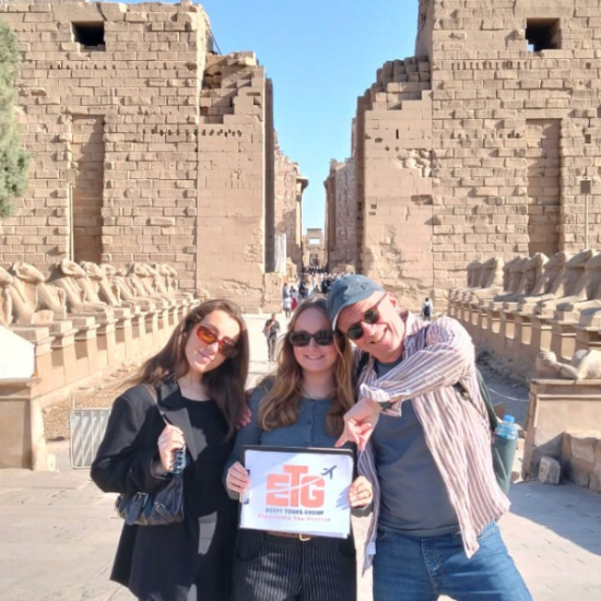 A family walking along the Avenue of Sphinxes at Karnak during our 6 Days Cairo, Luxor, Aswan & Abu Simbel Family Holiday package