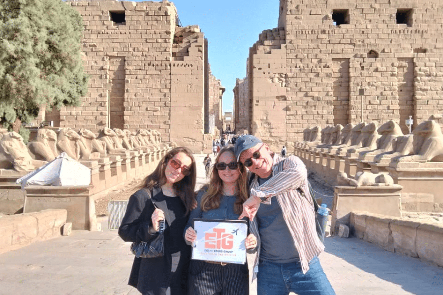 A family walking along the Avenue of Sphinxes at Karnak during our 6 Days Cairo, Luxor, Aswan & Abu Simbel Family Holiday package