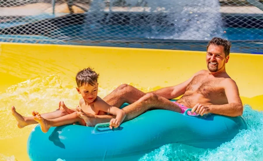 Father and son enjoying a swimming pool in Hurghada as a part of our 7 Days Cairo, Luxor and Hurghada Family Tour