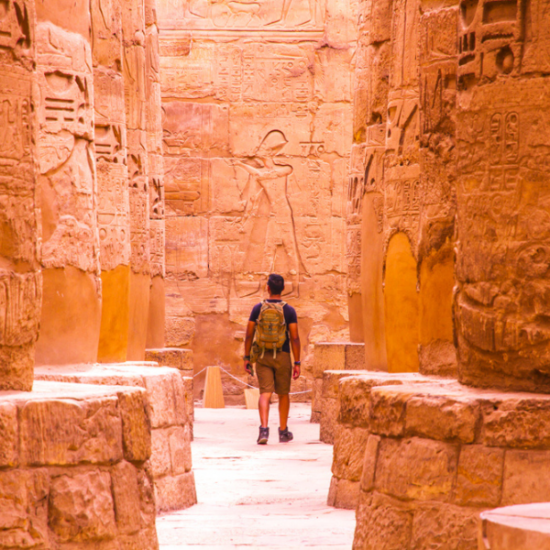 Tourist standing inside Karnak Temple
