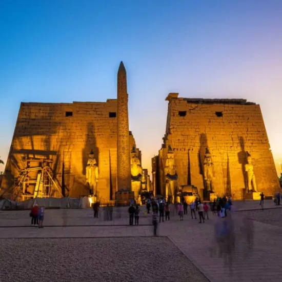Tourists visiting Luxor Temple at night