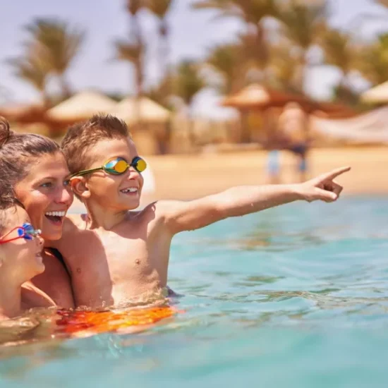 Mother and children playing in the water