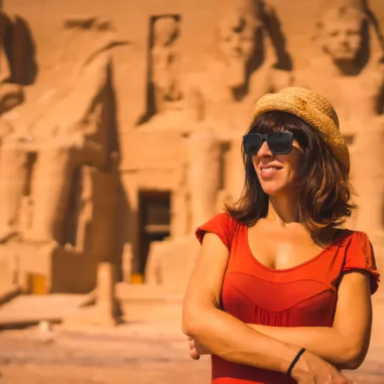 Female tourist standing in front of Abu Simbel Temple