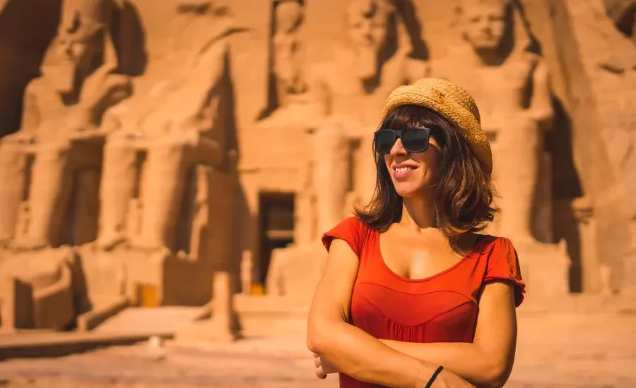 Female tourist standing in front of Abu Simbel Temple