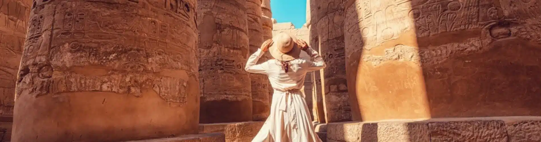 Tourist posing at Karnak Temple during our 5 Days Nile Cruise Family Holiday from Luxor to Aswan