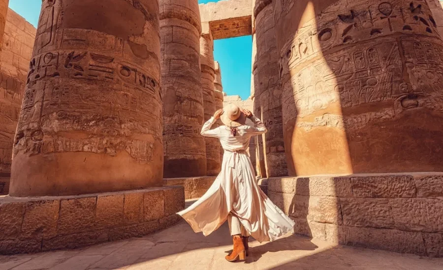 Tourist posing at Karnak Temple by day