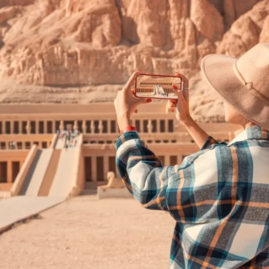 Tourist taking photos of Hatshepsut Temple
