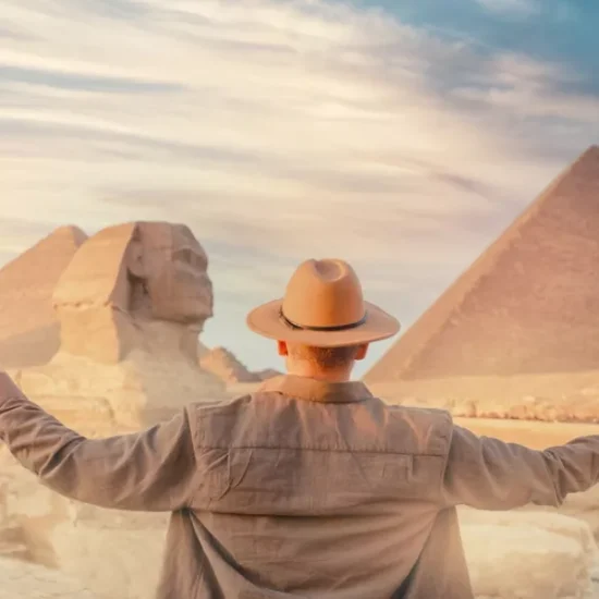 Tourist standing in front of the Pyramids