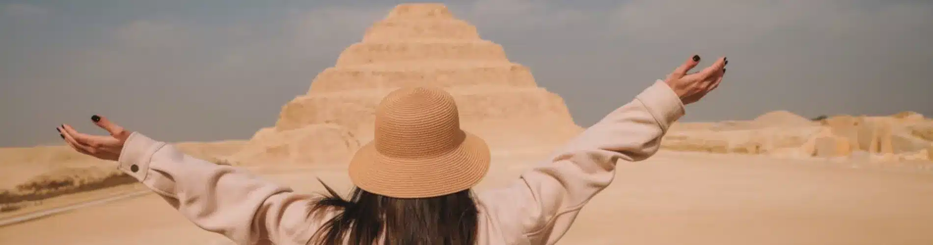 Tourist in front of the Saqqara Step Pyramid during our Enjoy our 8 Days Cairo, Luxor and Aswan Family Tour with the Pyramids, Grand Egyptian Museum, Karnak, Philae, Edfu and Kom Ombo at a family-friendly pace.