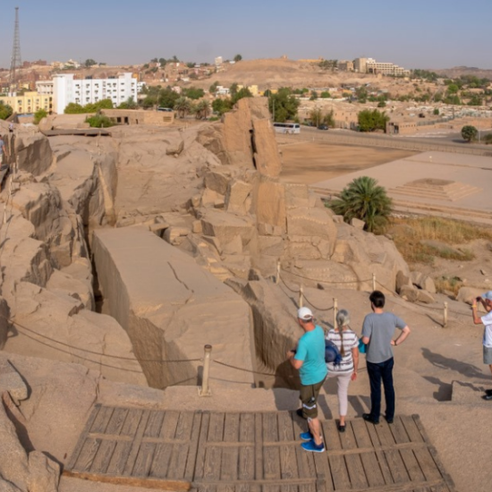 The Unfinished Obelisk in Aswan with visitors