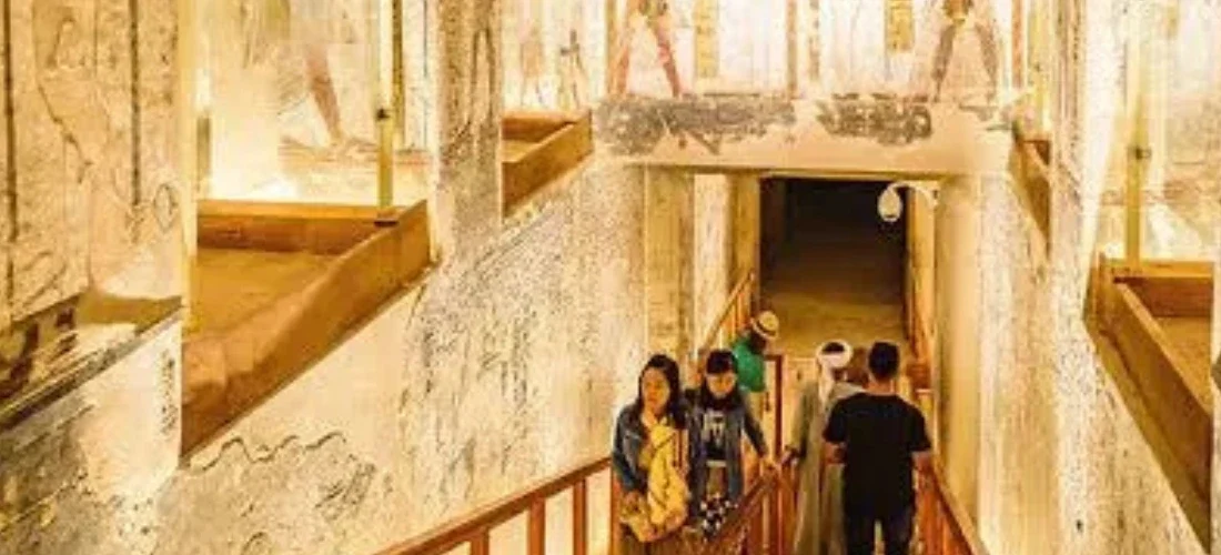 Valley of the Kings interior walkway with visitors a part of our 13 Days Cairo, Alexandria, Luxor & Aswan Family Tour