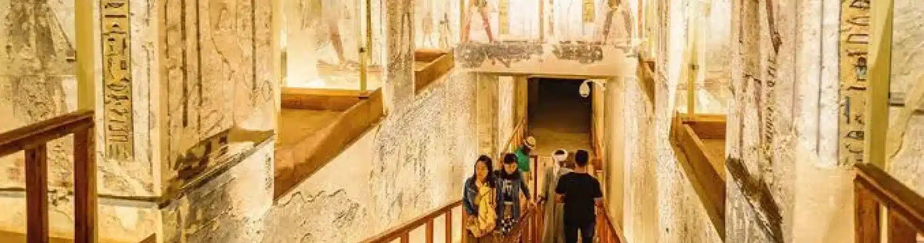 Valley of the Kings interior walkway with visitors a part of our 13 Days Cairo, Alexandria, Luxor & Aswan Family Tour