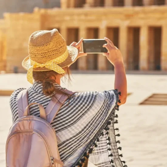 Visitor taking photos of Hatshepsut Temple