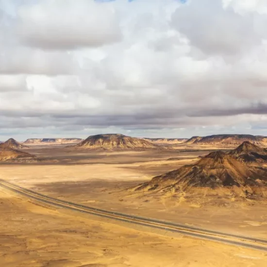 Tourist standing in the White Desert from behind