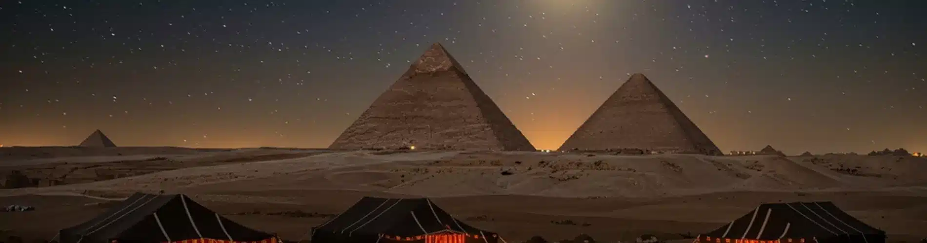 Pyramids of Giza illuminated at night as a part of our 14 Days Cairo, Alexandria, Hurghada & Nile Cruise Family Holiday
