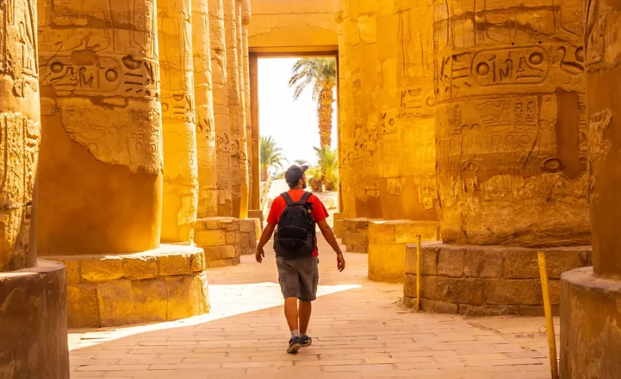 Tourist exploring Karnak Temple during the day