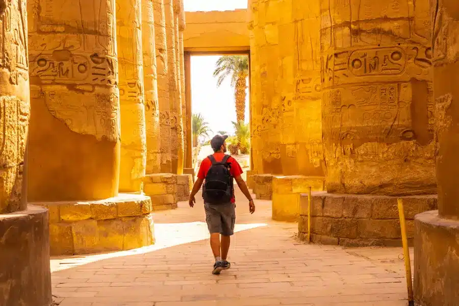 Tourist exploring Karnak Temple during the day