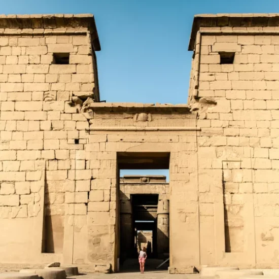 Tourist standing in front of Karnak Temple