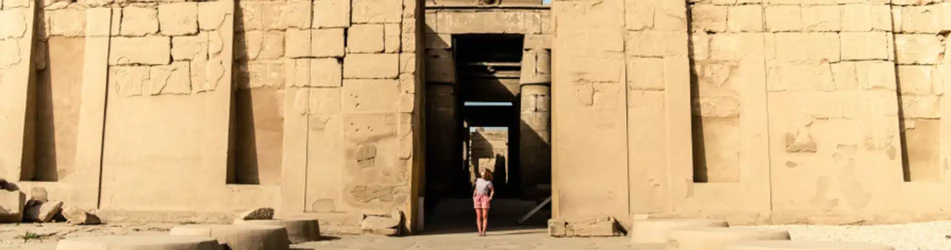 Tourist standing in front of Karnak Temple