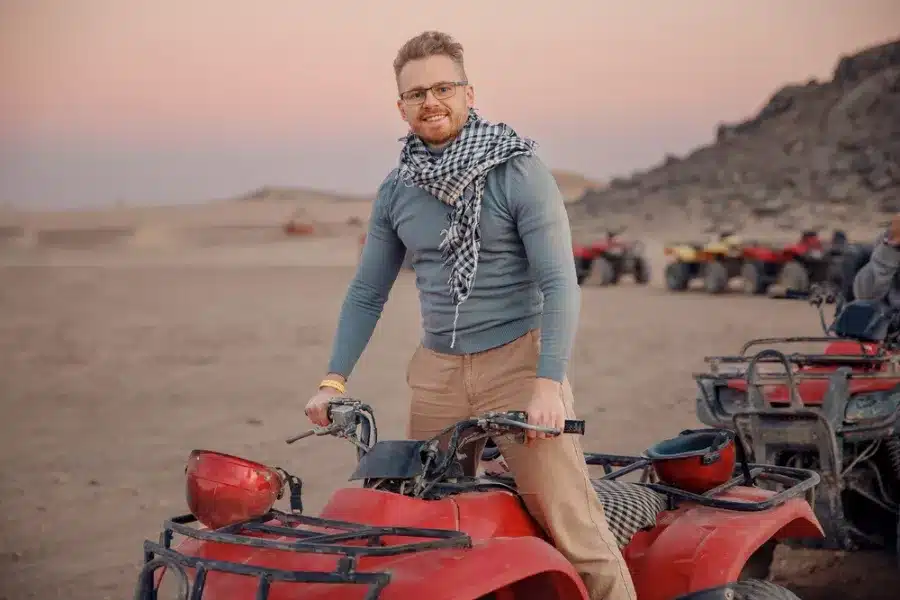 Tourist riding beach buggy Hurghada desert