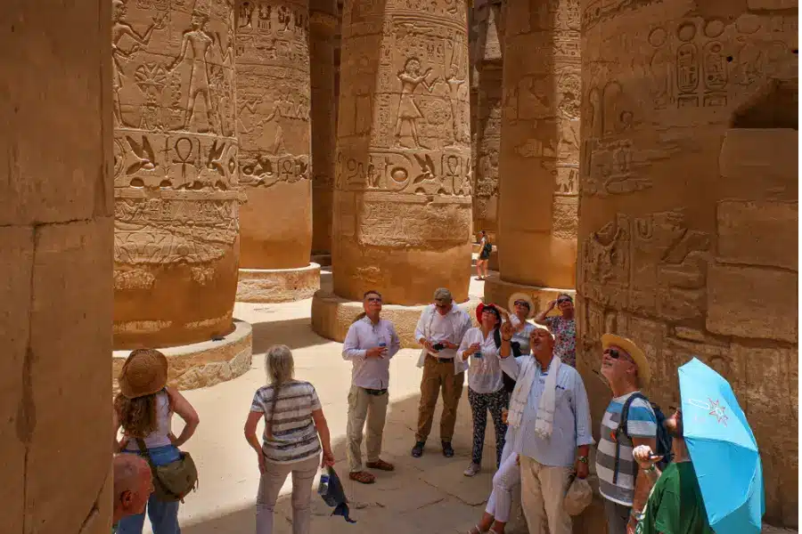 Tourists visiting an ancient Egyptian temple and experiencing local culture in Egypt - Egyptian Arabic Words and Phrases