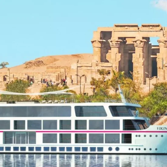 Nile cruise sailing near Philae Temple in Aswan