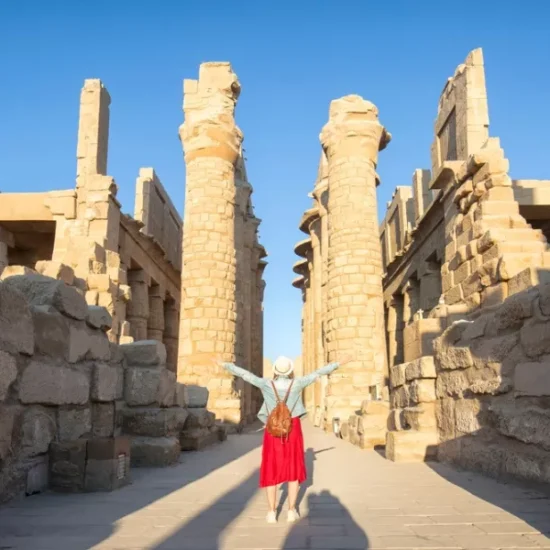 Tourist standing in front of Karnak Temple during our 5 Days Budget Nile Cruise Tour