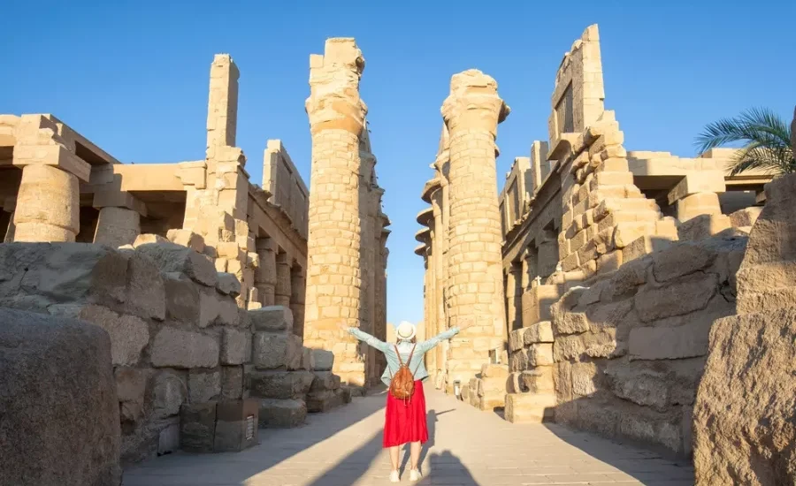 Tourist standing in front of Karnak Temple during our 5 Days Budget Nile Cruise Tour