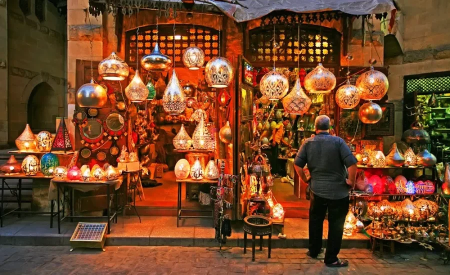 Tourist standing at a lantern shop in Khan El Khalili