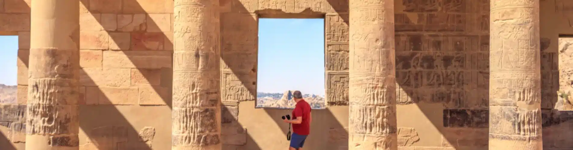 Tourist standing in front of Philae Temple