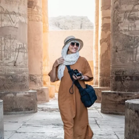 Tourist walking inside Karnak Temple in Luxor, during our 6 Days Budget Nile Cruise Tour Package from Cairo