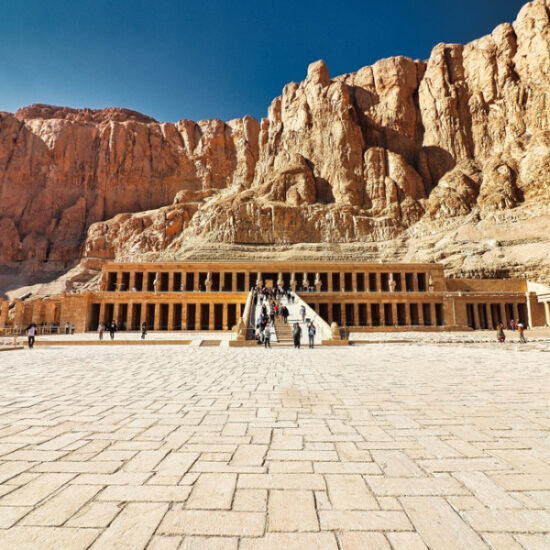 Tourists on the steps of Hatshepsut Temple, during our 6 Day Cairo, Alexandria, Luxor & Abu Simbel Cheap Tour