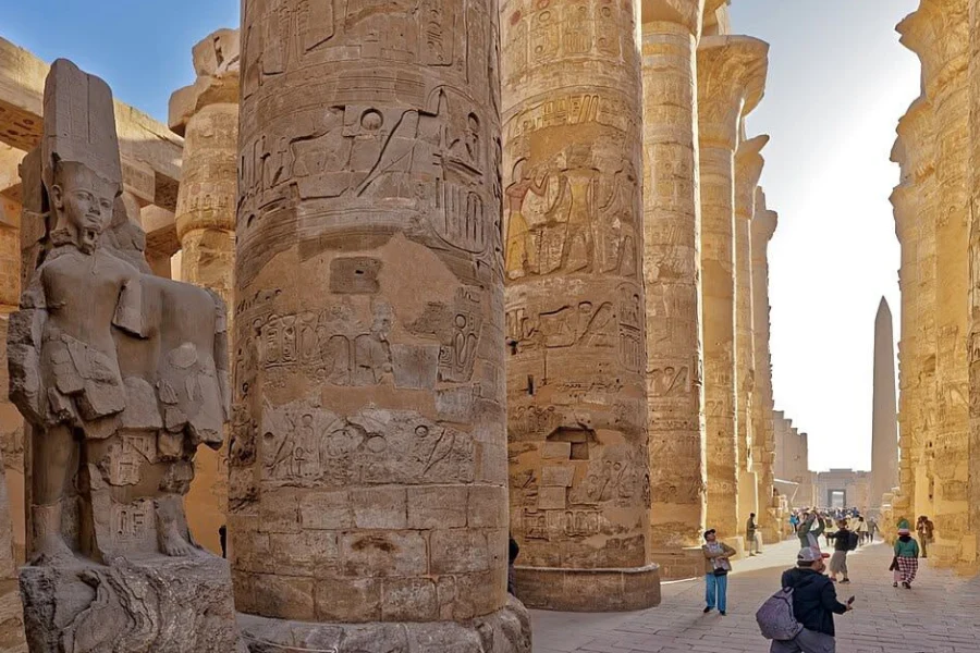 Tourists exploring Karnak Temple in Luxor during our 6 Days Cairo, Luxor & Aswan Budget Holiday