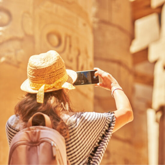 Tourist taking photos at Karnak Temple, 9 Days Cairo, Luxor & Hurghada Budget Tour