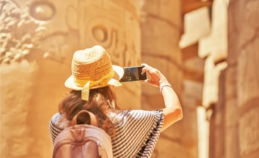 Tourist taking photos at Karnak Temple