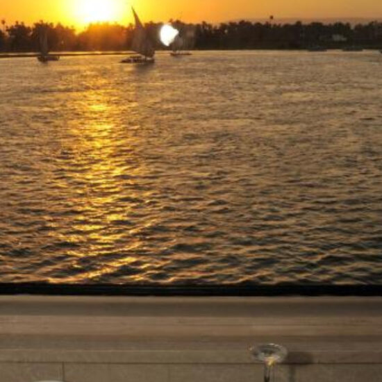 Dining table overlooking the Nile aboard the cruise