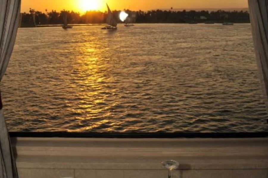Dining table overlooking the Nile aboard the cruise