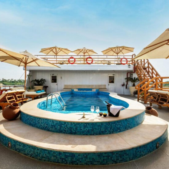 Swimming pool and loungers on the cruise sun deck