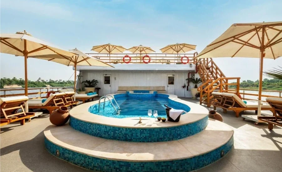 Swimming pool and loungers on the cruise sun deck